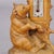 A Wooden Carved Black Forest Thermometer with Bear A finely carved Black Forest desk set with a bear sitting next to a...