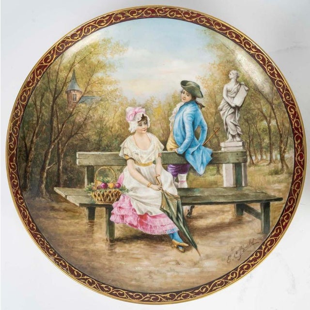 Pair of large decorative dishes, Napoleon III period, 19th century in Limoges porcelain, hand-painted. H: 3cm, D: 40cm