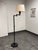 Design Plus Gallery presents a Library Style Swing-Arm Floor Lamp. This floor lamp has a metal frame with a round weighted...