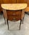 This is a Louis XV style mahogany inlaid commode with a sienna marble top over two inlaid drawers, supported by slender...