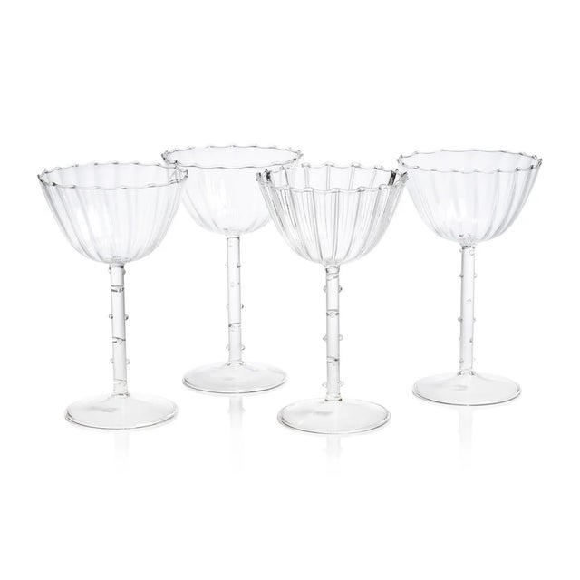 The Chaumont Coupe Glasses bring vintage elegance to any occasion with their exquisite detailing and refined silhouette....