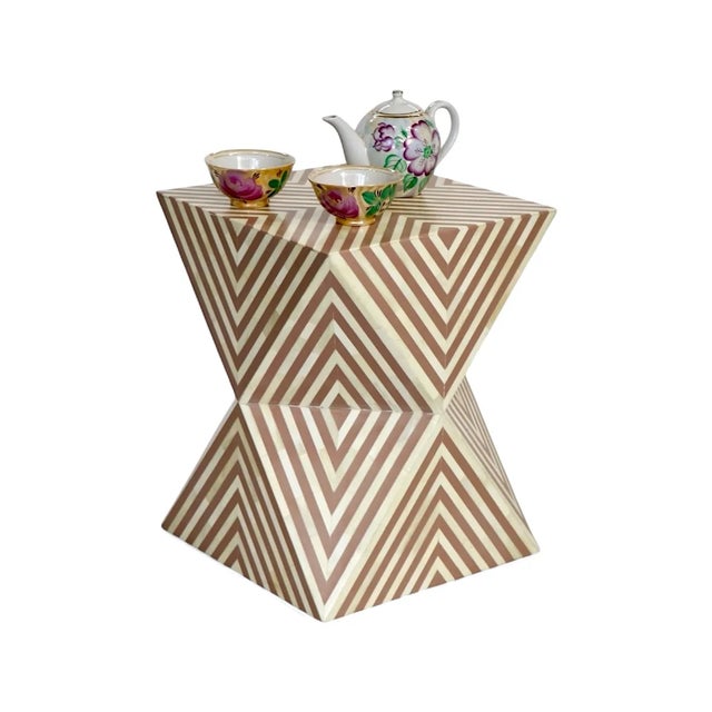 Transform your home with the striking Visionary Bone Inlay Side Table, a masterpiece of craftsmanship and design....