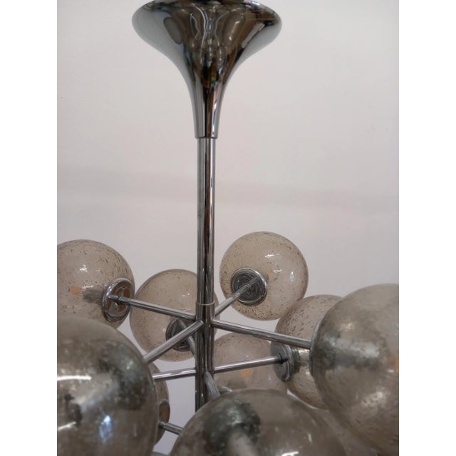 Very rare Space Age chandelier with 13 transparent glass balls in excellent condition. This piece has an attribution mark,...