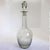 DETAILS Antique clear glass decanter with bulbous body and long neck and faceted stopper. With fan and honeycomb pattern....