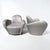 Fabulous pair of award-winning Miami swivel lounge chairs by Michael Wolk. All hardwood frame with interlocking,...