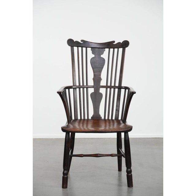 We are offering this charming, timeless, antique English Windsor chair from the 18th century with a beautiful patina and a...