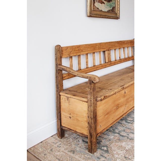 Width: 72 inches Height: 36 inches Depth: 20 inches A beautifully timeworn antique English pine storage bench, dating to...