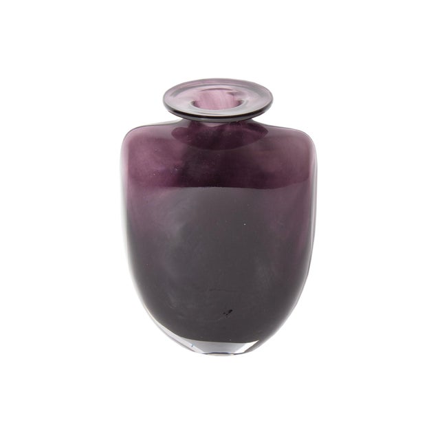 A "Swing" glass vase designed by the Swedish artist and designer Kjell Engman (born 1946) for Kosta Boda. Made from a deep...