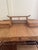 Standout vintage British Colonial Style desk crafted in faux burnt bamboo and grasscloth featuring a pagoda style top over...