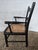 Authentic late 19th-century antique child’s armchair featuring a classic ladder-back design with gently turned arms and an...