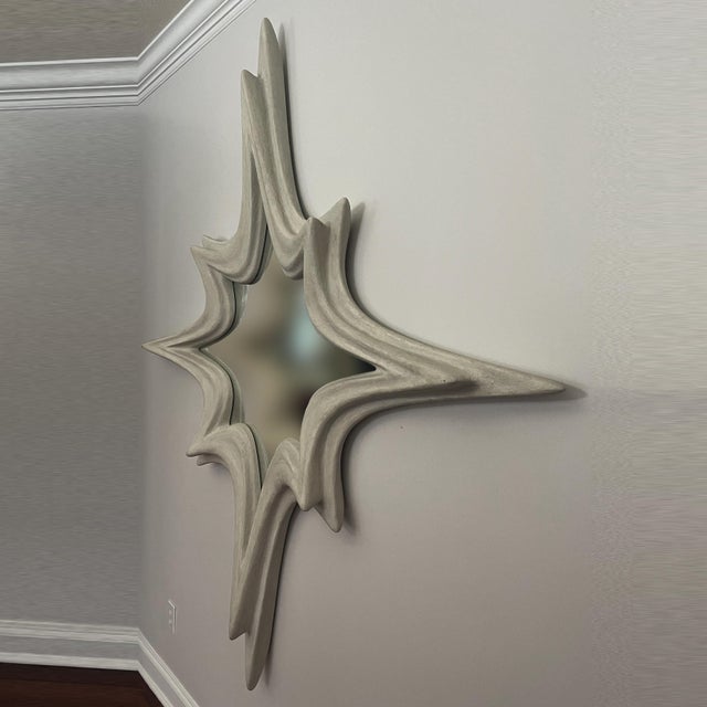 Mirror No. 3 is a large-scale wall-mounted mirror object designed by Chris Delmar. Its broad, symmetrical form combines a...