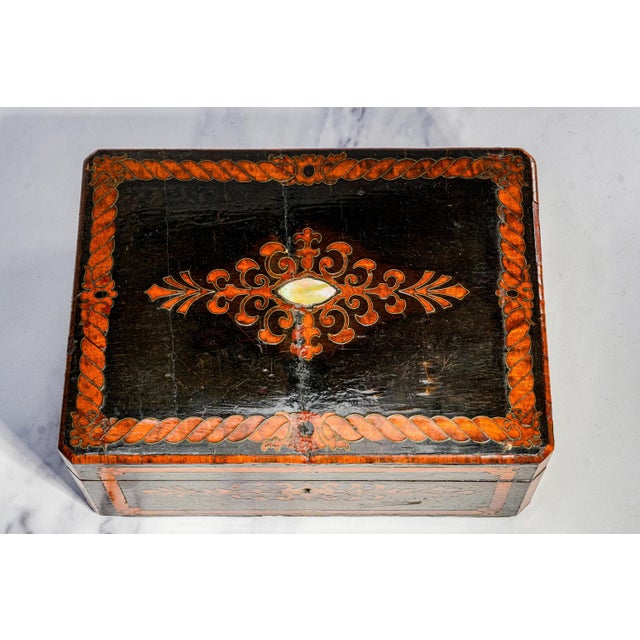 A handsome and highly decorative 19th-century lacquered wooden box, this piece showcases the rich craftsmanship and visual...