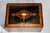 A handsome and highly decorative 19th-century lacquered wooden box, this piece showcases the rich craftsmanship and visual...