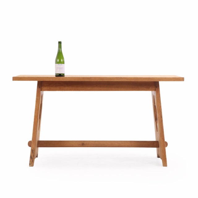 Constructed in solid oak, this French table features Gothic-style quatrefoil cut-out detailing, evoking medieval...