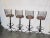 Midcentury set of four wrought iron bar stools in excellent condition. They are in the style of Arthur Umanoff with the...