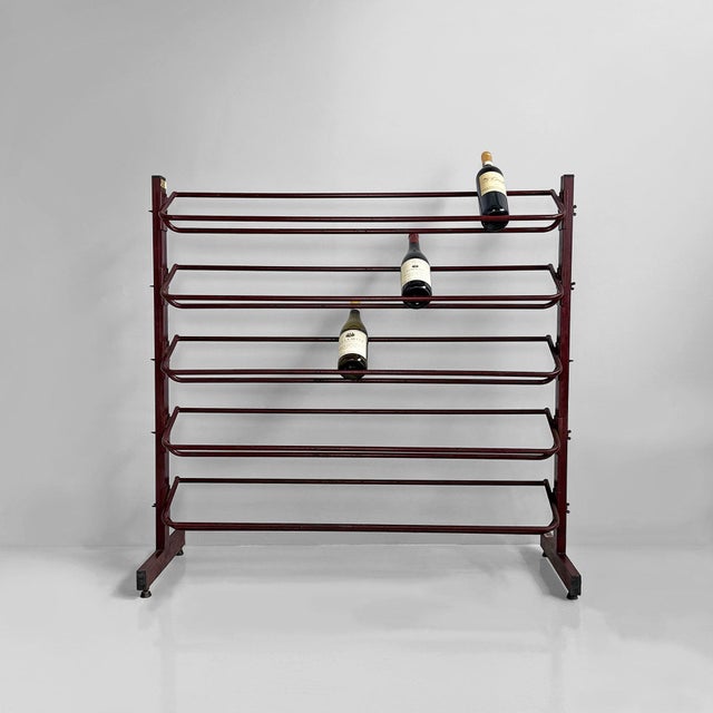 Italian industrial floor-standing metal bottle rack, 1990s. Industrial floor-standing bottle rack entirely made of...