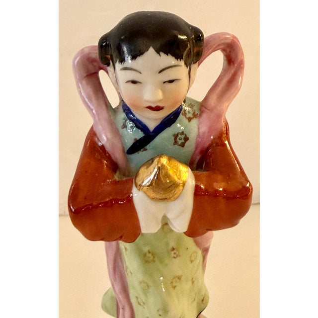 Chinese Famille Rose porcelain girl prosperity figurine, typically dating back to the early 20th century (Late Qing...