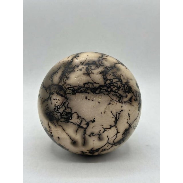 Exquisite small Southwestern-style pottery vase featuring dramatic smoke-cured horsehair markings integrated into a...