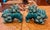 Rich turquoise marbling highlights this pair of ferocious foo dogs, originally created to protect the owners home from...