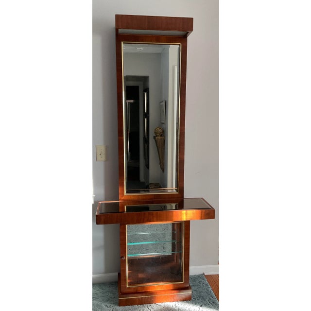 Very Cool Character. Tall, sophisticated clean lines. Beautiful condition. Mirrored lower display case under a floating...