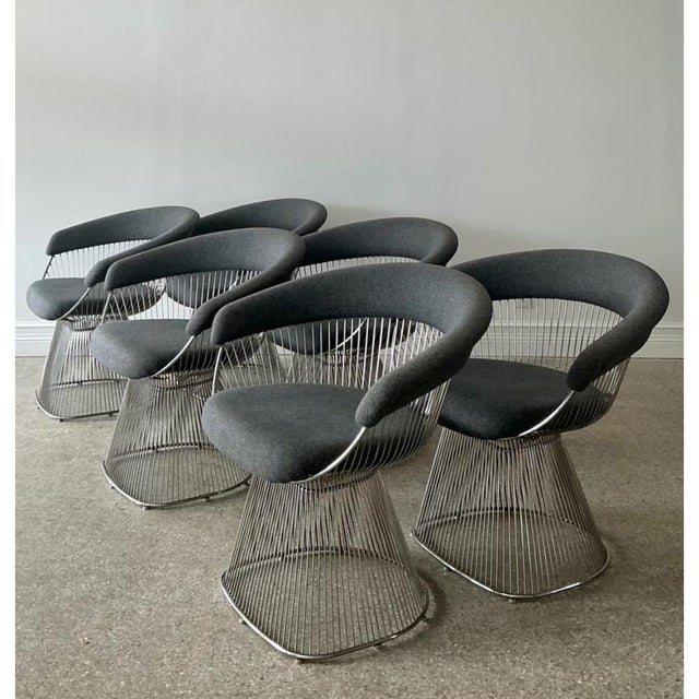 This vintage set of six Platner-style wire dining chairs brings sculptural mid-century elegance to the dining room. Each...