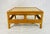 A charming vintage bamboo coffee table featuring a hand-crafted capiz shell inlaid top, dating from the 1970s. This square...