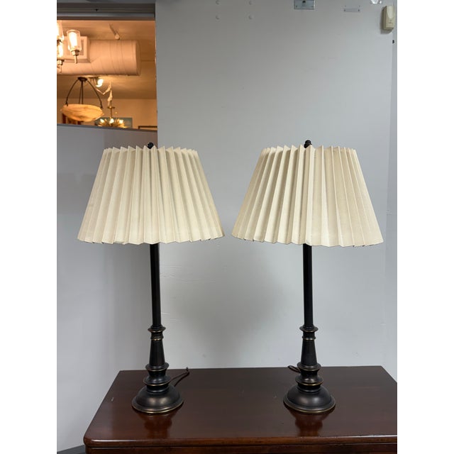 Design Plus Gallery presents a Pair of Vintage Table Lamps from Stiffel. This matching pair showcases black metal column...