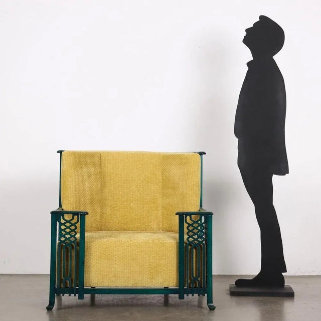 Armchair attributable to the production of the Giorgetti company, wood lacquered with aniline paint, foam padding, velvet...