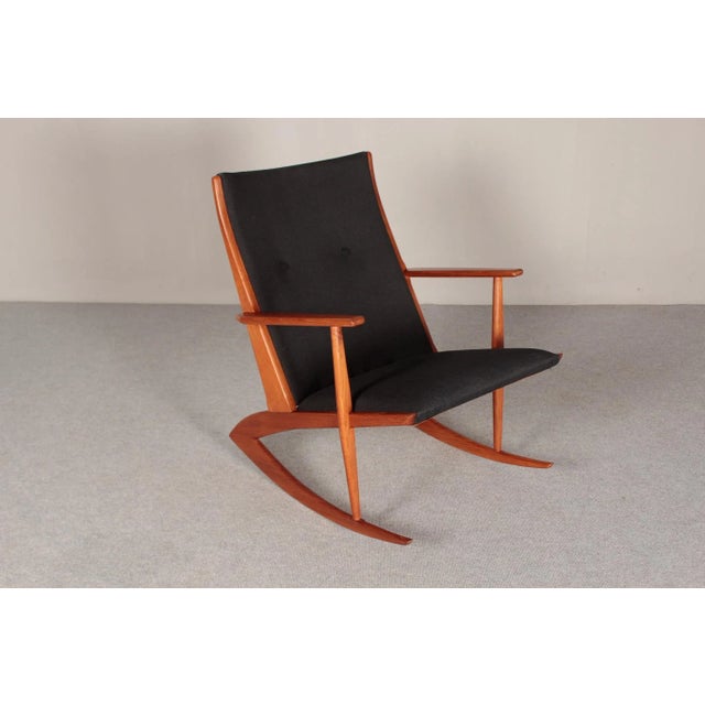 Rocking chair, solid teak, made in Denmark, circa 1960. Design: Soren Georg Jensen Two embossed stamps on the inside of...