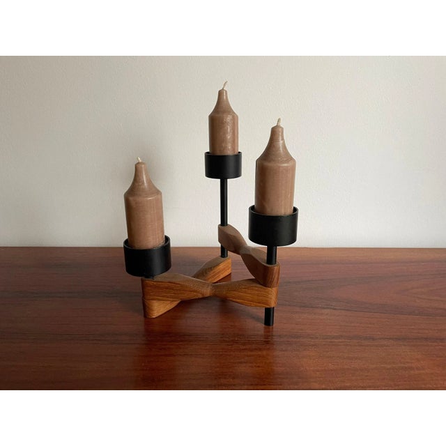 Rare and beautiful candlestick from the 60s for your Stuga: The candlestick is made of teak and metal and impresses with...