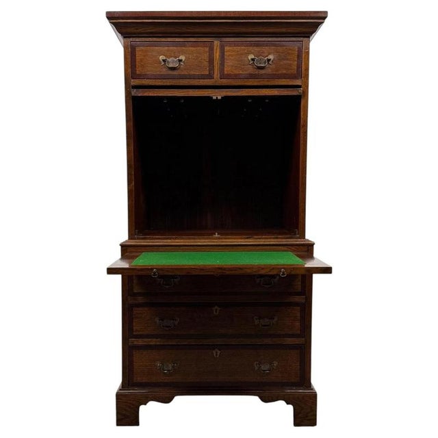 A wonderfully unusual and beautifully crafted 20th-century oak cupboard, distinguished by its ingenious storage...