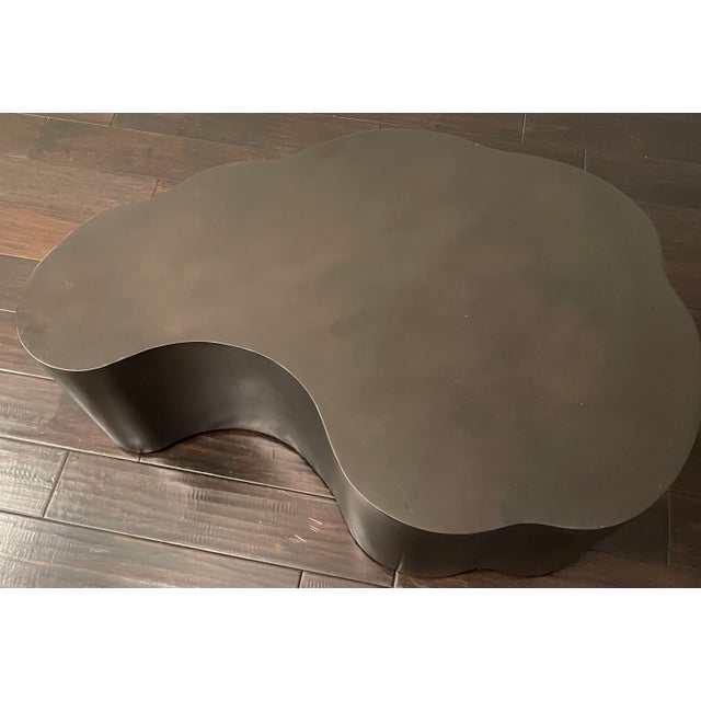 Bring a sculpted, organic silhouette to your living space with this authentic Arteriors Meadow Coffee Table in a rich...