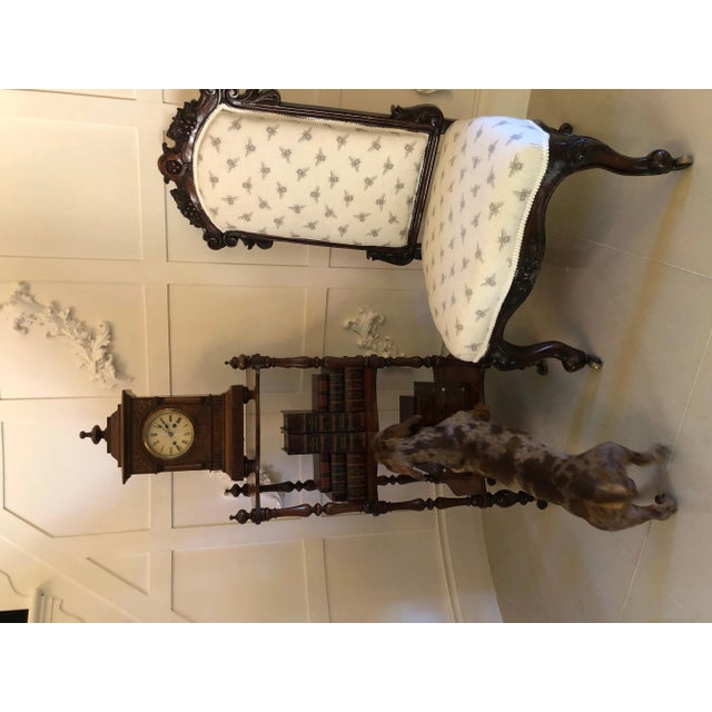 Antique Victorian freestanding rosewood whatnot having three attractive serpentine shaped shelves supported by eight solid...