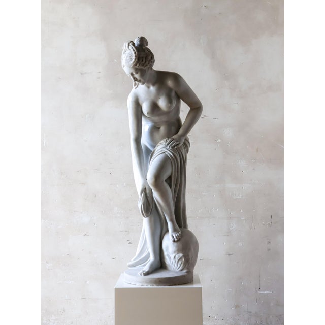 Marble sculpture of a bathing woman, crafted in white marble after the renowned 'La Baigneuse' model by Christophe-Gabriel...