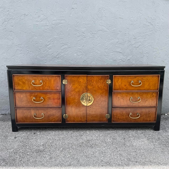 A striking vintage Chinoiserie dresser by Wayside featuring richly figured burlwood drawer and door fronts framed in a...