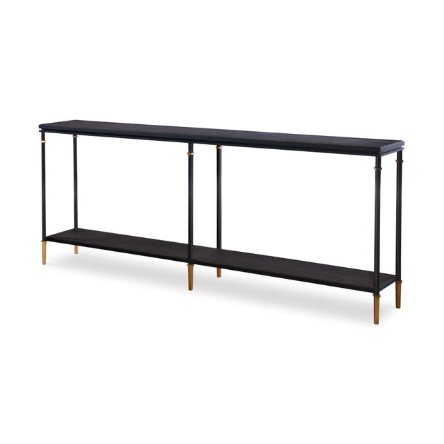 Introduce a touch of modern elegance to your entryway or living space with this oak and bronze metal console table. The...
