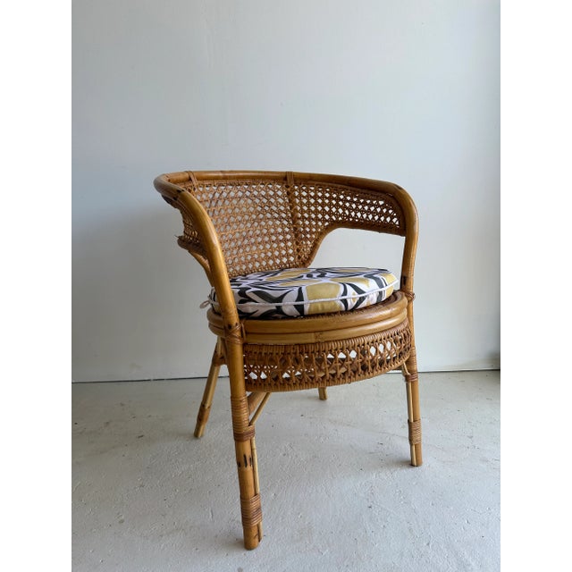 This vintage chair is a nice accent piece and fits well as a boho or coastal vibe. The rattan is tightly woven and...