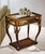 Handcrafted in Italy from olive ash burl, this curio end table features clear beveled glass panels on all four sides,...
