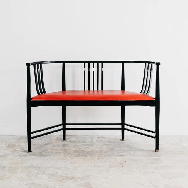 A refined two-seater sofa (indoor bench) from the postmodern era dating back to the 1980s. The design is a clear and...