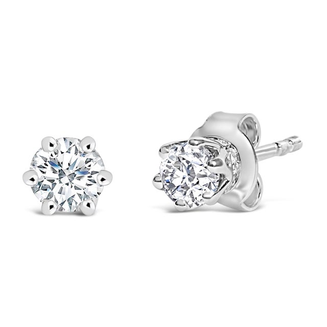 Immerse yourself in the understated elegance of these dazzling stud earrings, expertly fashioned from lustrous 14K...
