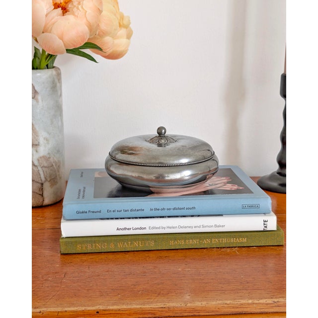 A vintage pewter circular lidded trinket box by Just Andersen circa 1930s. with a beautiful floral handle and beaded...