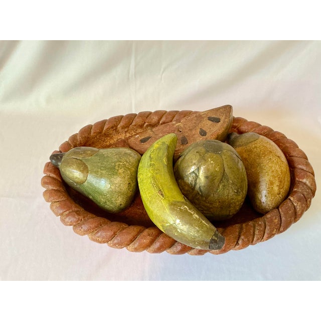 Vintage terra cotta pottery braided bowl filled with various hand painted fruit. The fruit is clad on top with bronze and...