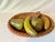 Vintage terra cotta pottery braided bowl filled with various hand painted fruit. The fruit is clad on top with bronze and...