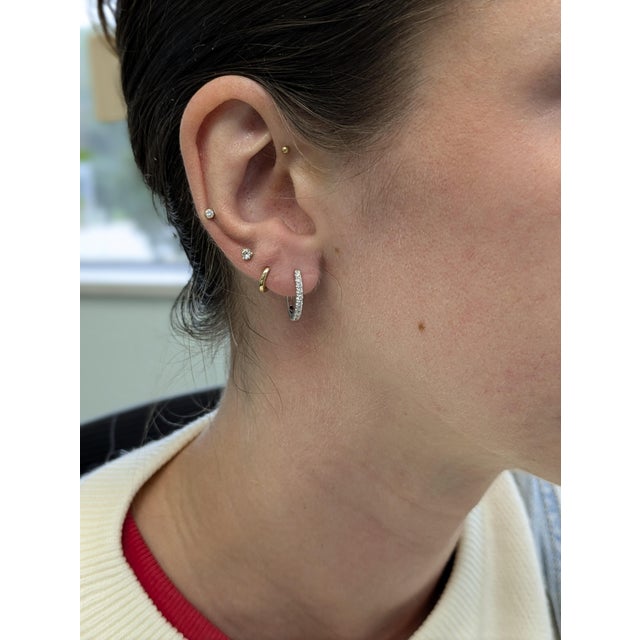 Sleek, subtle, and sparkling — these 14k white gold diamond hoops are your daily dose of sophistication. With genuine...