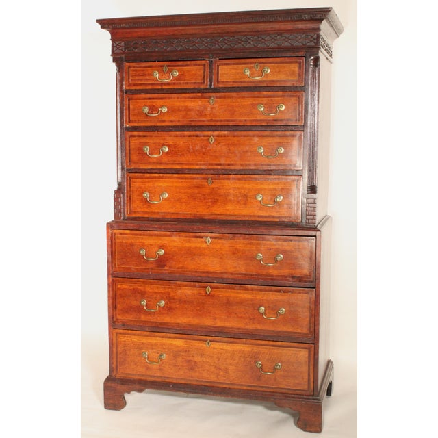 Antique George III style oak chest on chest, 1st half of the 19th century. Having a cove pediment with dental style...