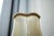 Antique table lamp made from a portable candlestick. The lampshade is also antique - the original lampshade technique in...