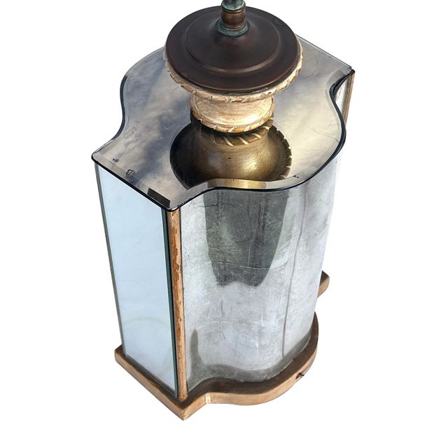 The shaped lamp with slumped glass mirrored panels; the front panel with a Chinoiserie reverse-painted scene; all resting...