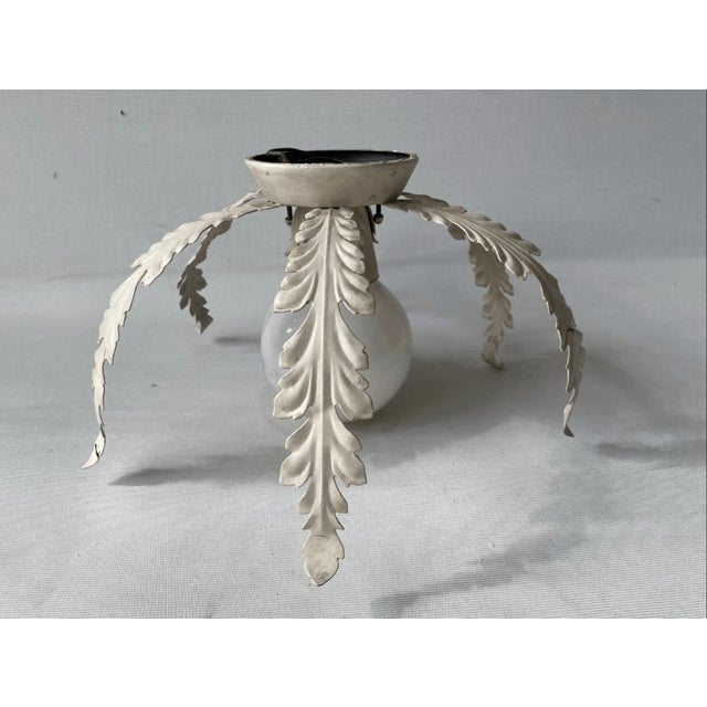 11” diameter 4” tall three holes to attach it to the ceilling. Good condition This fixture features six elegantly curved,...