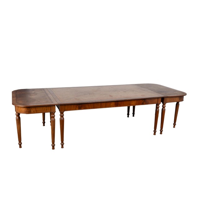 This large and unique English leather top table is from the turn of the century. Attractive mahogany, turned legs and...