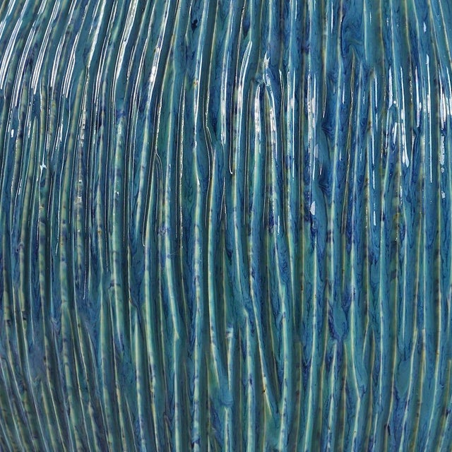 Organic texture and coastal-inspired color join your space with this table lamp. Features a sculptural ceramic base...